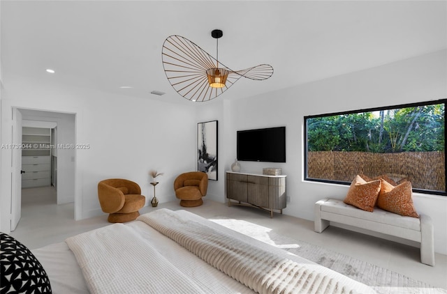 bedroom featuring concrete flooring