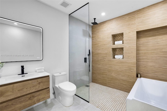 full bath with a walk in shower, visible vents, vanity, and tile patterned floors