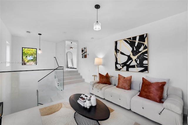 living room featuring stairway