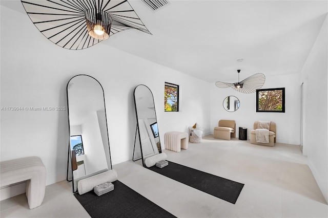 workout room featuring visible vents and light carpet