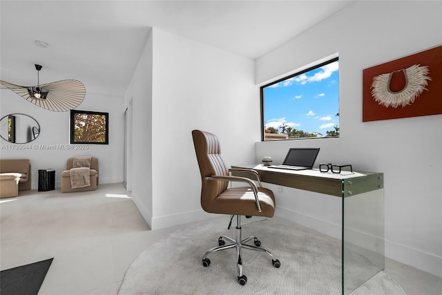 office space with plenty of natural light and baseboards