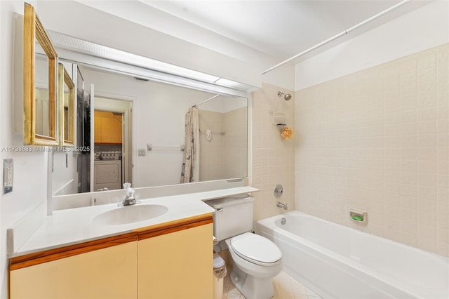 full bathroom featuring tile patterned floors, toilet, vanity, shower / bath combination with curtain, and washer / clothes dryer