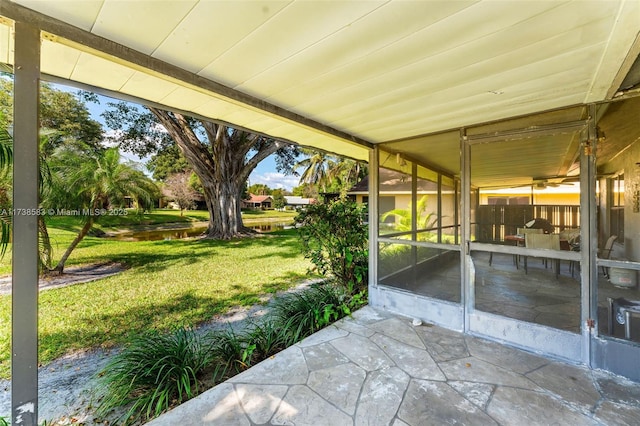 view of patio featuring a sunroom