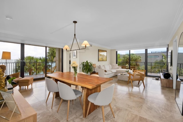 801 N Venetian Dr Unit 201, Miami, FL 33139 - dining area featuring floor to ceiling windows, crown molding, plenty of natural light, and a chandelier