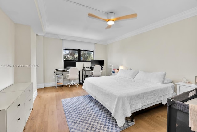 bedroom with ceiling fan, ornamental molding, light wood-type flooring, and baseboards