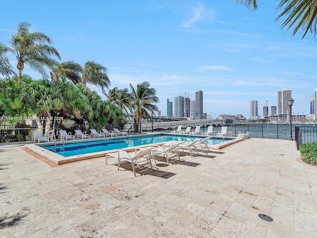 801 N Venetian Dr Unit 201, Miami, FL 33139 - community pool with a view of skyline and a patio area