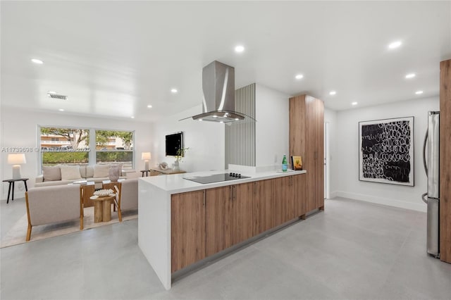 kitchen featuring stainless steel refrigerator, black electric stovetop, kitchen peninsula, and exhaust hood