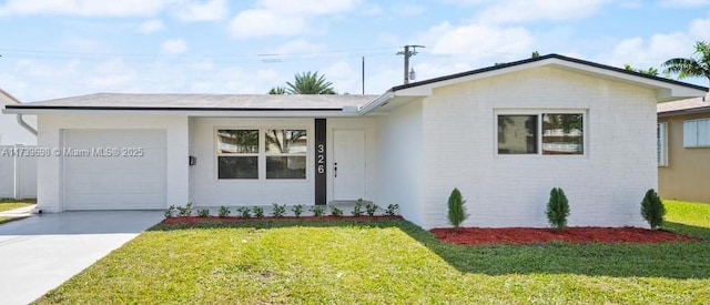 326 SE 3rd St, Dania Beach, FL 33004 - ranch-style home featuring a garage, a front yard, driveway, and brick siding
