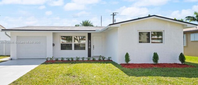 326 SE 3rd St, Dania Beach, FL 33004 - single story home featuring an attached garage, a front yard, concrete driveway, and brick siding
