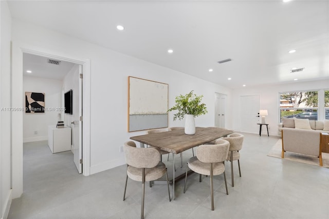 dining space with concrete floors, visible vents, and recessed lighting