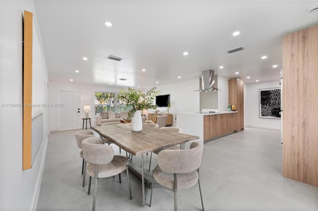 dining area with baseboards, visible vents, concrete flooring, and recessed lighting