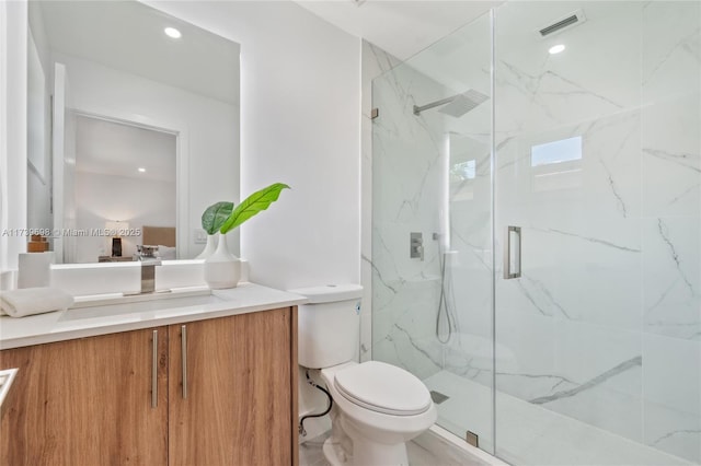 bathroom with toilet, recessed lighting, visible vents, vanity, and a marble finish shower