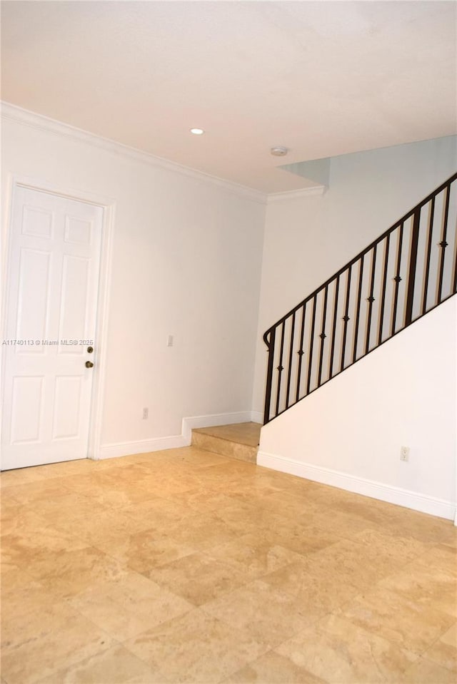 interior space featuring crown molding, recessed lighting, and baseboards