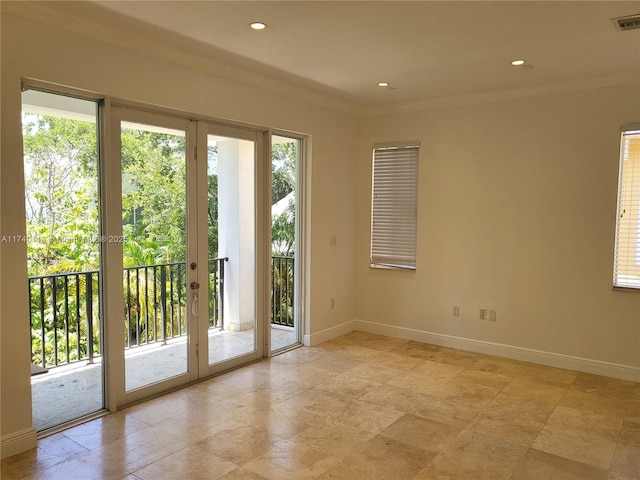 doorway to outside with french doors, baseboards, a wealth of natural light, and ornamental molding