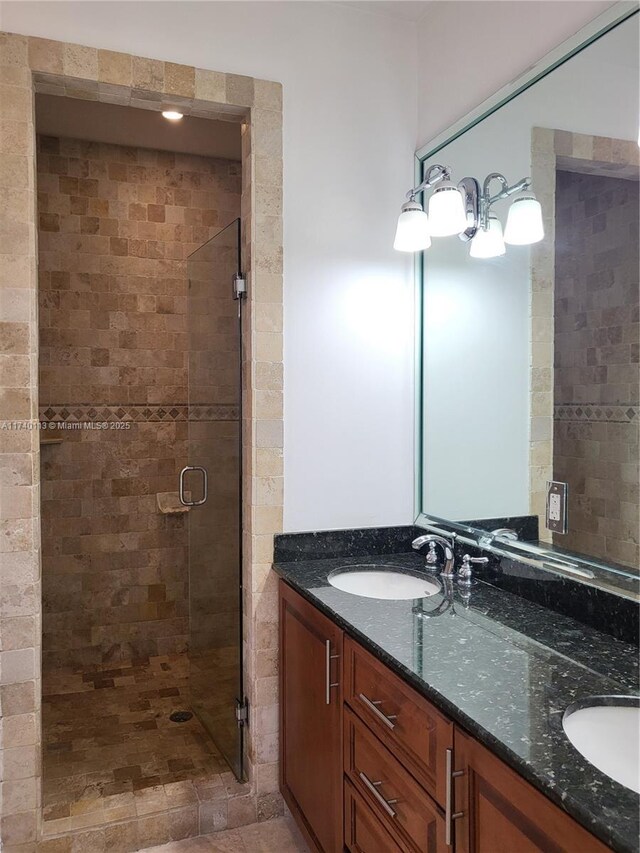 bathroom with vanity and walk in shower