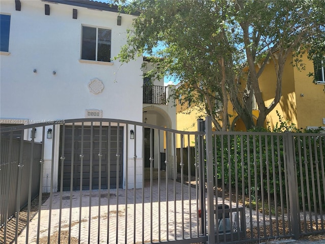 view of gate featuring a fenced front yard