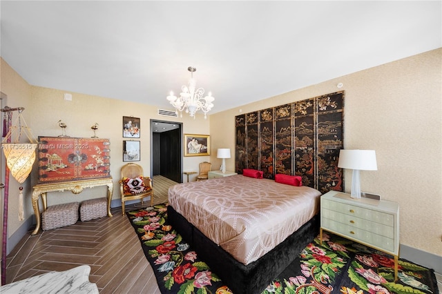 bedroom with an inviting chandelier and hardwood / wood-style flooring