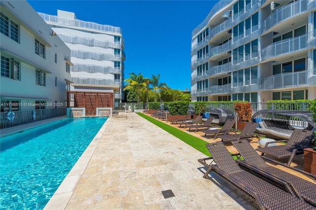 view of swimming pool featuring a patio area