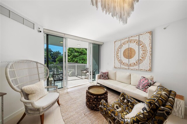 living room featuring floor to ceiling windows