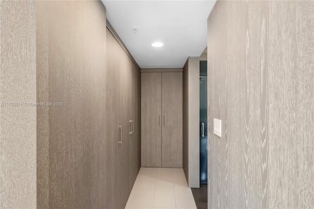 hallway with light tile patterned floors