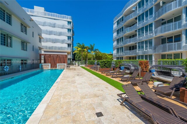 view of swimming pool with a patio