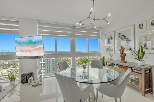 dining room with floor to ceiling windows and light tile patterned floors