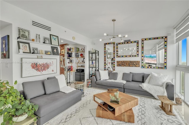 living room featuring built in shelves and a chandelier