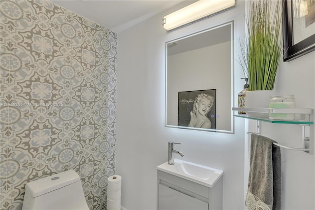 bathroom with vanity and toilet