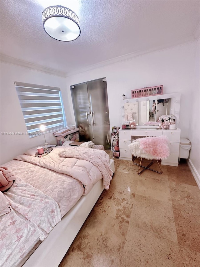 bedroom with ornamental molding, a closet, and a textured ceiling