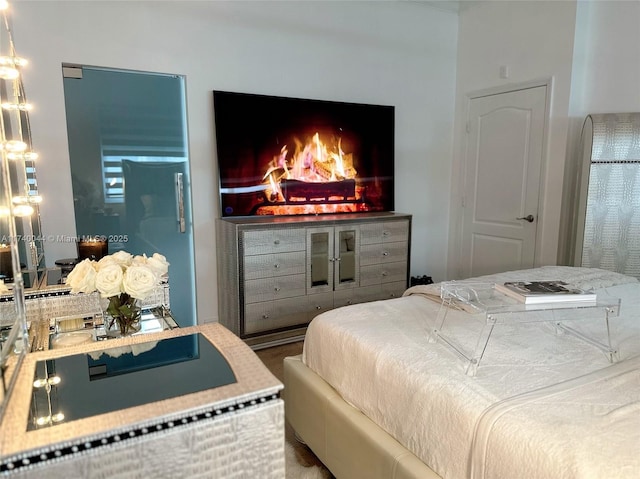 bedroom featuring a fireplace