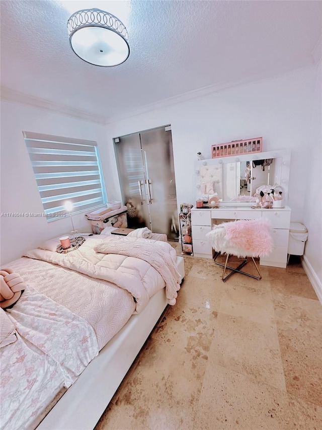 bedroom featuring crown molding, a textured ceiling, and a closet