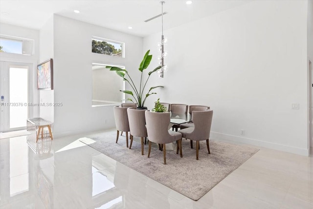 dining room with a high ceiling