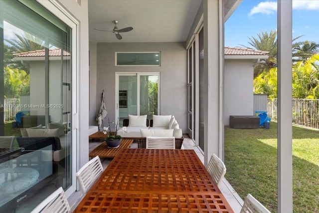 sunroom / solarium with ceiling fan