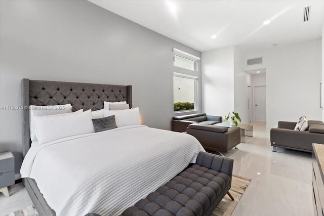 bedroom featuring a high ceiling