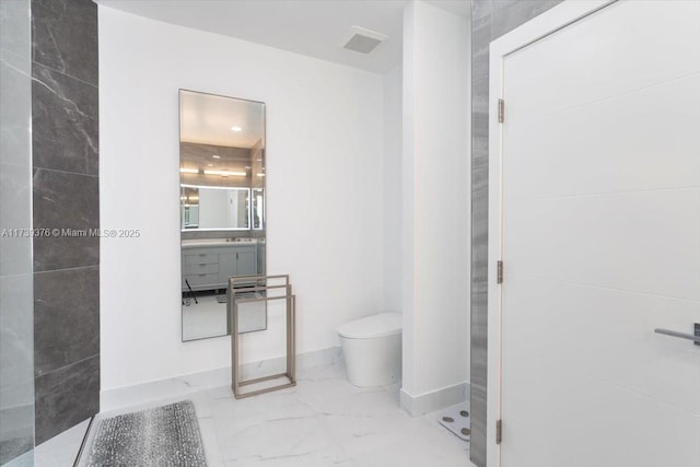 bathroom with vanity and toilet