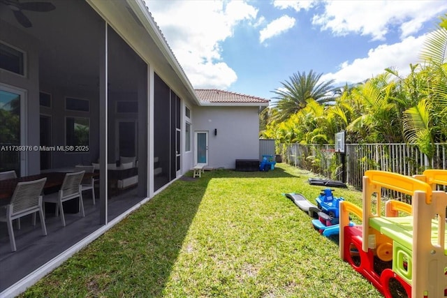 view of yard with a sunroom