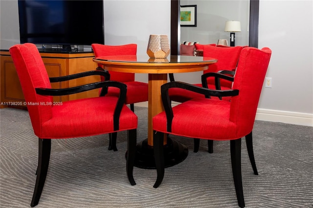 view of carpeted dining area