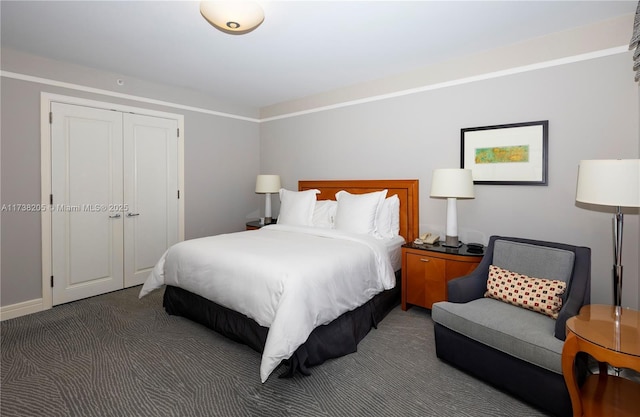 carpeted bedroom with a closet