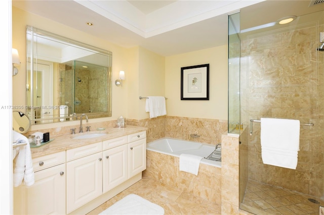 bathroom featuring shower with separate bathtub and vanity