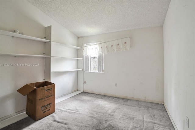 unfurnished bedroom featuring carpet flooring, vaulted ceiling, and a textured ceiling