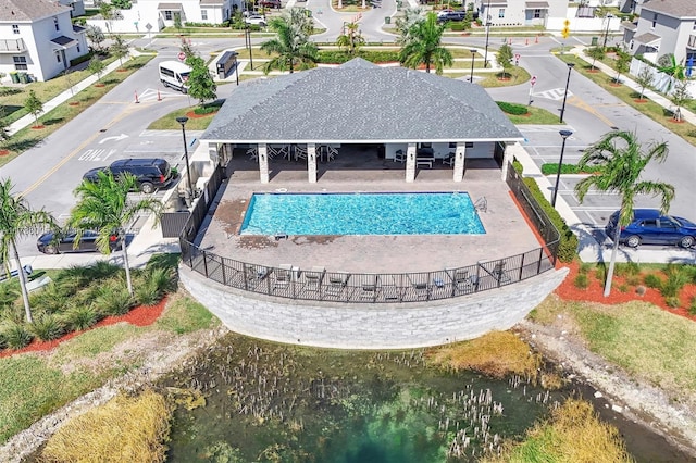 view of swimming pool featuring a water view