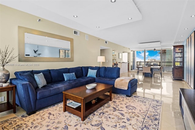 living room with floor to ceiling windows