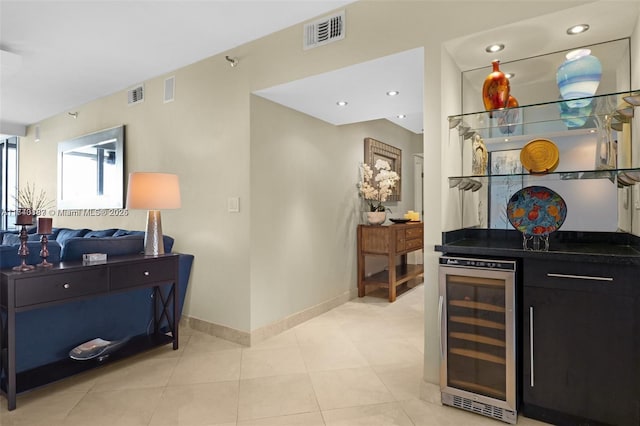 interior space with beverage cooler and light tile patterned floors