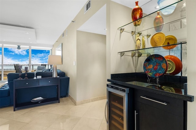 kitchen featuring wine cooler and light tile patterned flooring