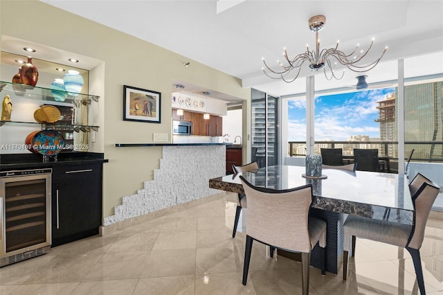 tiled dining area with wine cooler, expansive windows, bar area, and a notable chandelier