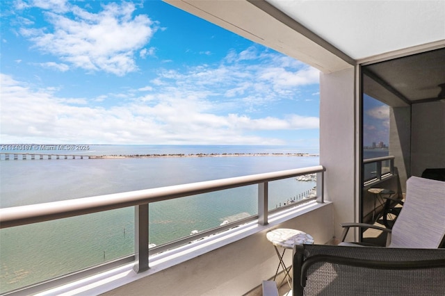 balcony featuring a water view