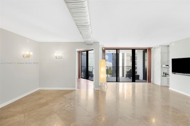 unfurnished room featuring floor to ceiling windows