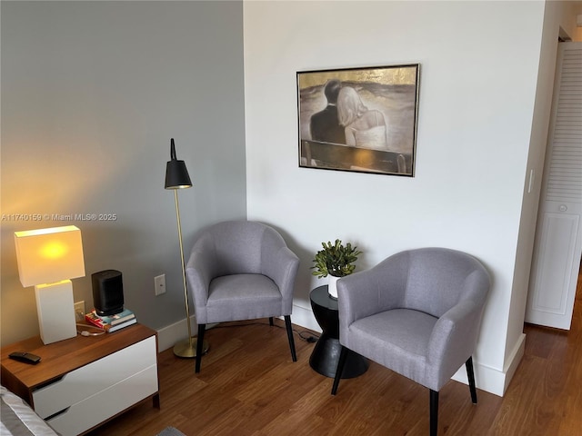 sitting room featuring hardwood / wood-style floors