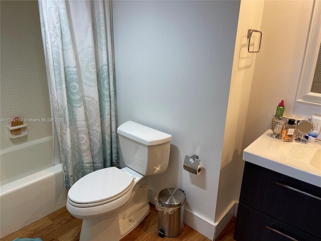 full bathroom with wood-type flooring, shower / bathtub combination with curtain, vanity, and toilet