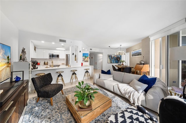 living room with a notable chandelier